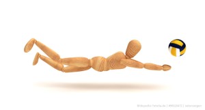 Das Foto zeigt eine Puppe mit einem Volleyball. Sie symbolisiert die Mannequin Challenge im Volleyball